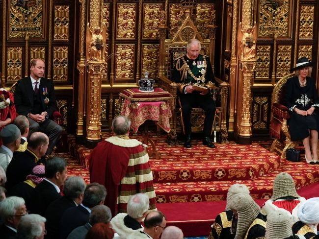 Prince Charles, Prince of Wales reads the Queen's speech next to her Imperial State Crown.