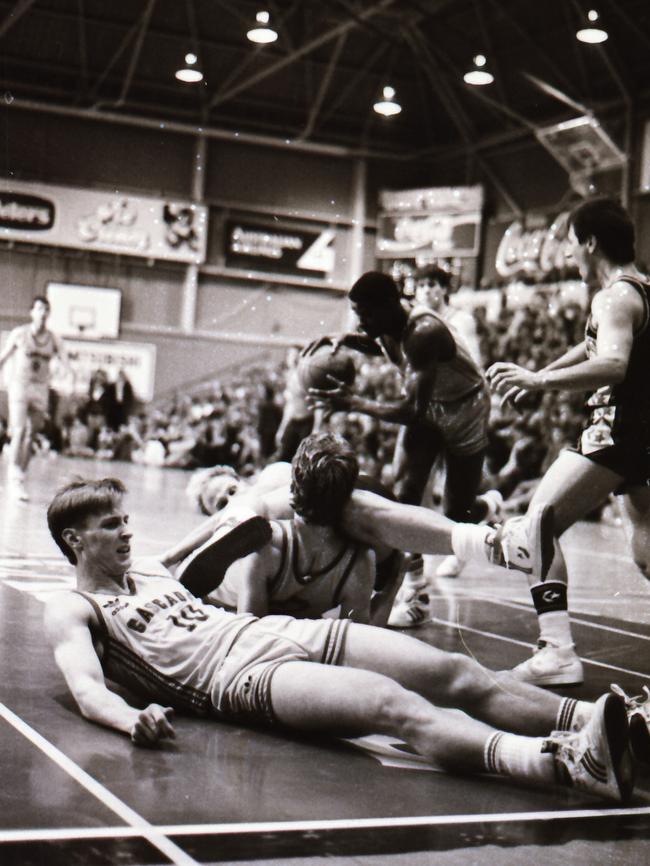 Dan van Holst Pellekaan (lying down), in a match for the Tassie Devils.