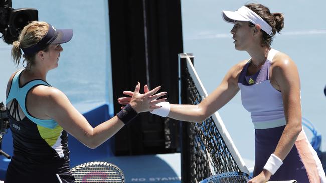 A shake for the winner: Pavlyuchenkova congratulates Muguruza after the match. Picture: AP