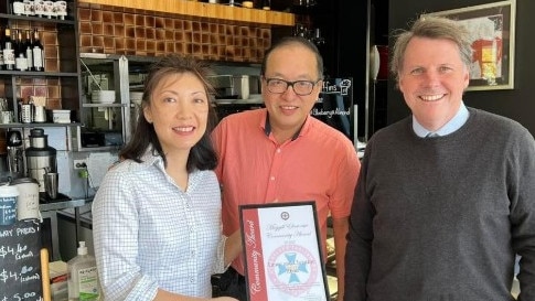 Christine and Lance Zhou, from Plum Cafe, with Moggill MP, Dr Christian Rowan.