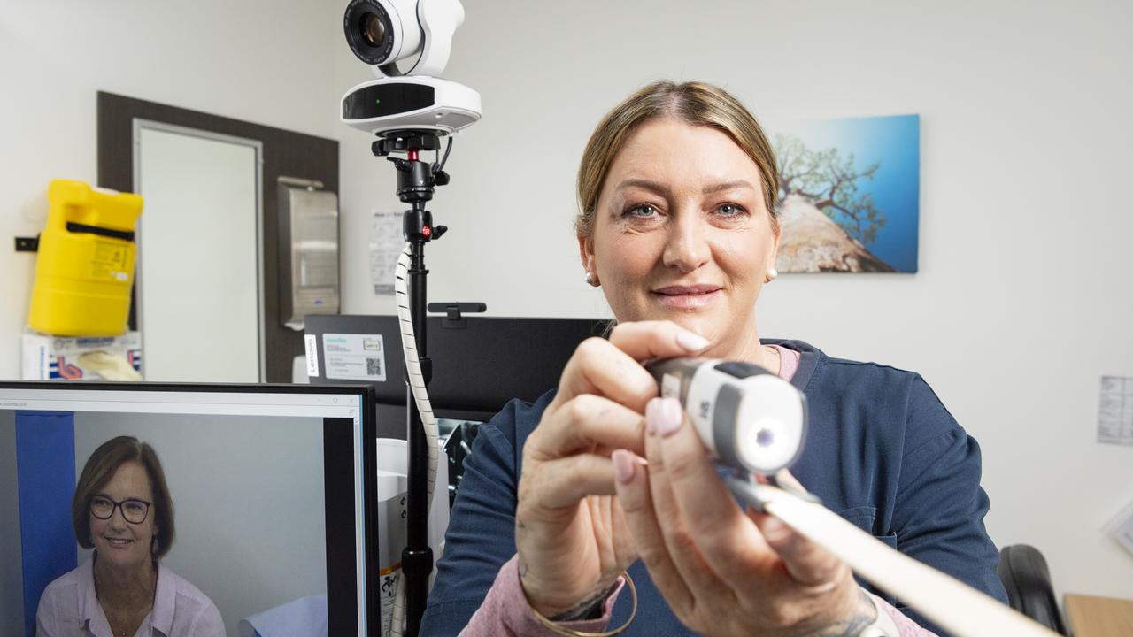 Clifton Community Health Services practice nurse Simone Jackson demonstrates with primary health and wellness manager Anne-Marie Donovan (on-screen) the state-of-the-art telehealth equipment used for virtual appointments as part of a UQ research project into virtual integrated care, Monday, May 22, 2023. Picture: Kevin Farmer