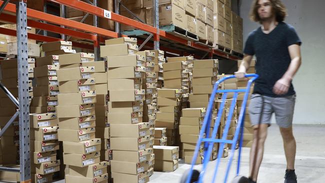 Warehouse staff at Ascent Shoes in Virginia, Brisbane. Picture: AAP