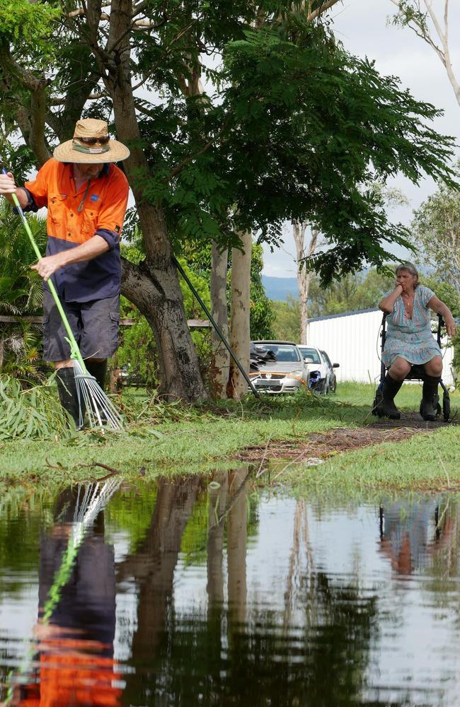 The Lamb family of Purono Park tidy up the minimal effects of Tropical Cyclone Kirrily on Saturday morning. Picture: Blair Jackson