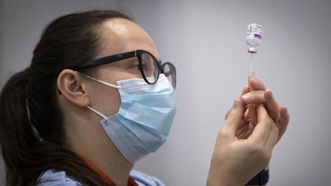 A member of the vaccine team prepares a syringe with a dose of the AstraZeneca-Oxford Covid-19 vaccine in Edinburgh, Scotland. Picture: AFP