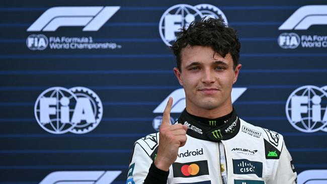 McLaren's British driver Lando Norris celebrates after taking pole position