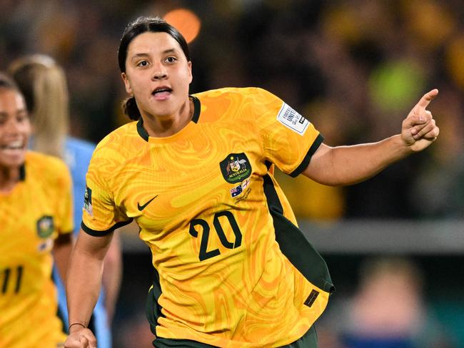 FILES-- This file photo taken on August 16, 2023 shows Australia's forward Sam Kerr celebrating scoring her team's first goal during the Australia and New Zealand 2023 Women's World Cup semi-final football match between Australia and England at Stadium Australia in Sydney. Chelsea and Australian women's football star Sam Kerr has been charged with a "racially aggravated offence" in Britain following a dispute involving a police officer, London's Metropolitan Police said March 4. The 30-year-old striker, one of the highest profile and best-paid players in the women's game, was charged following an incident in London in January 2023, a police statement read. (Photo by IZHAR KHAN / AFP)