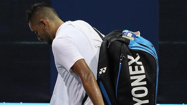 Kyrgios makes his way back to the change rooms as the boos rain down. Picture: AFP