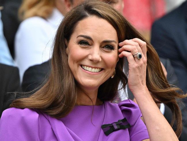 TOPSHOT - Britain's Catherine, Princess of Wales reacts as she arrives in the Royal Box on Centre Court to attend the men's singles final tennis match on the fourteenth day of the 2024 Wimbledon Championships at The All England Lawn Tennis and Croquet Club in Wimbledon, southwest London, on July 14, 2024. (Photo by ANDREJ ISAKOVIC / AFP) / RESTRICTED TO EDITORIAL USE