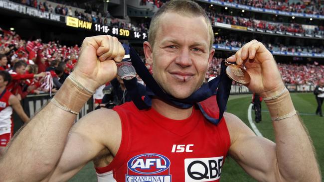 Ryan O’Keefe with his premiership and Norm Smith Medals in 2012.