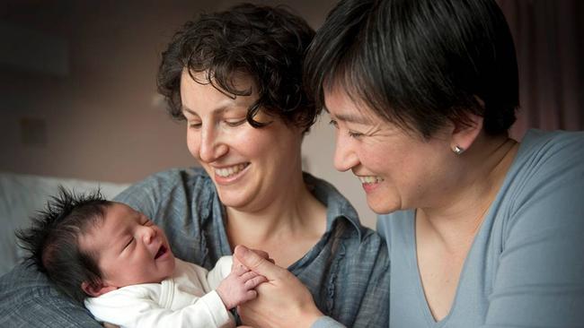 Senator Penny Wong and partner Sophie Allouache with their newborn baby girl Alexandria at their home in Adelaide.