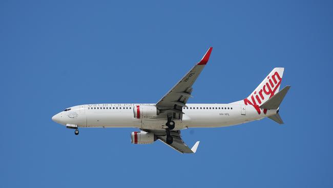 General, generic, stock photo of a Virgin Australia passenger jet airplane coming in to land at the Cairns Airport, bringing domestic tourists into the Far North Queensland region. PICTURE: BRENDAN RADKE