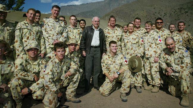 Former Prime Minister John Howard – pictured in Pakistan with members of the ADF – said nothing made him prouder than when visiting Australia’s troops overseas.