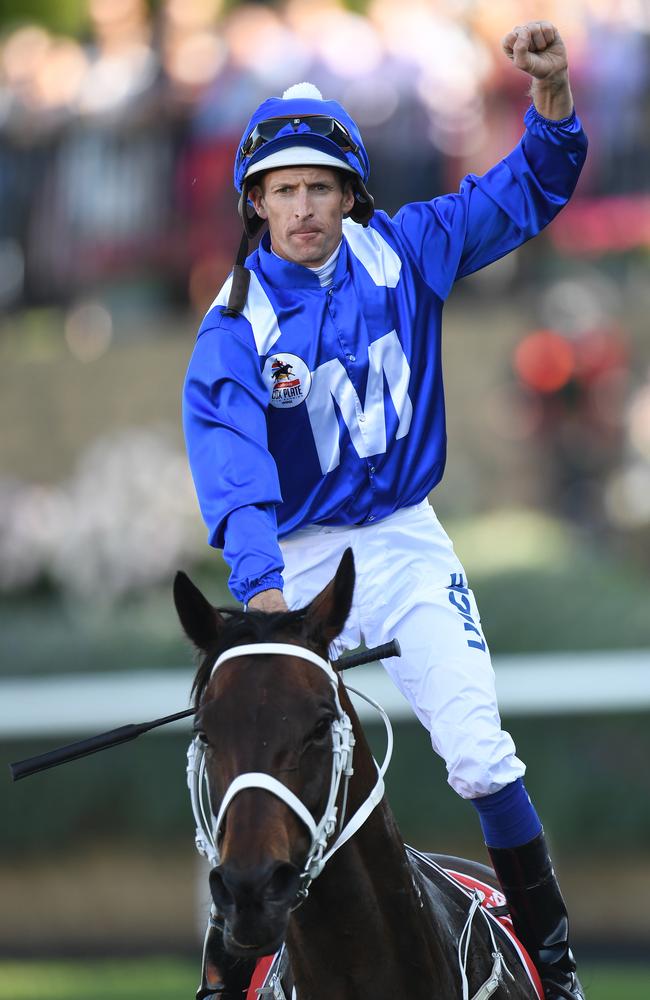 Hugh Bowman reacts after Winx’s victory in the 2017 Cox Plate. Picture: AAP