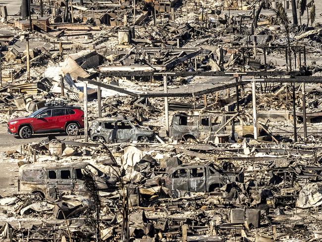 Homes and vehicles destroyed by the Palisades Fire. Picture: AP Photo/Noah Berger