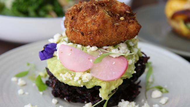 Smashed avo on beetroot fritters, the Smalltown way. Picture: Martin Lange