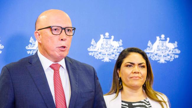 (FILES) Shadow minister for Indigenous Australians Jacinta Nampijinpa Price (R) and Opposition Leader Peter Dutton attend a press conference following the results of Australia's historic Indigenous rights referendum, in Brisbane on October 14, 2023. Australia holds a general election May 3, 2025, a hard-fought contest between party leaders with sharply contrasting visions for the country. (Photo by Patrick HAMILTON / AFP)