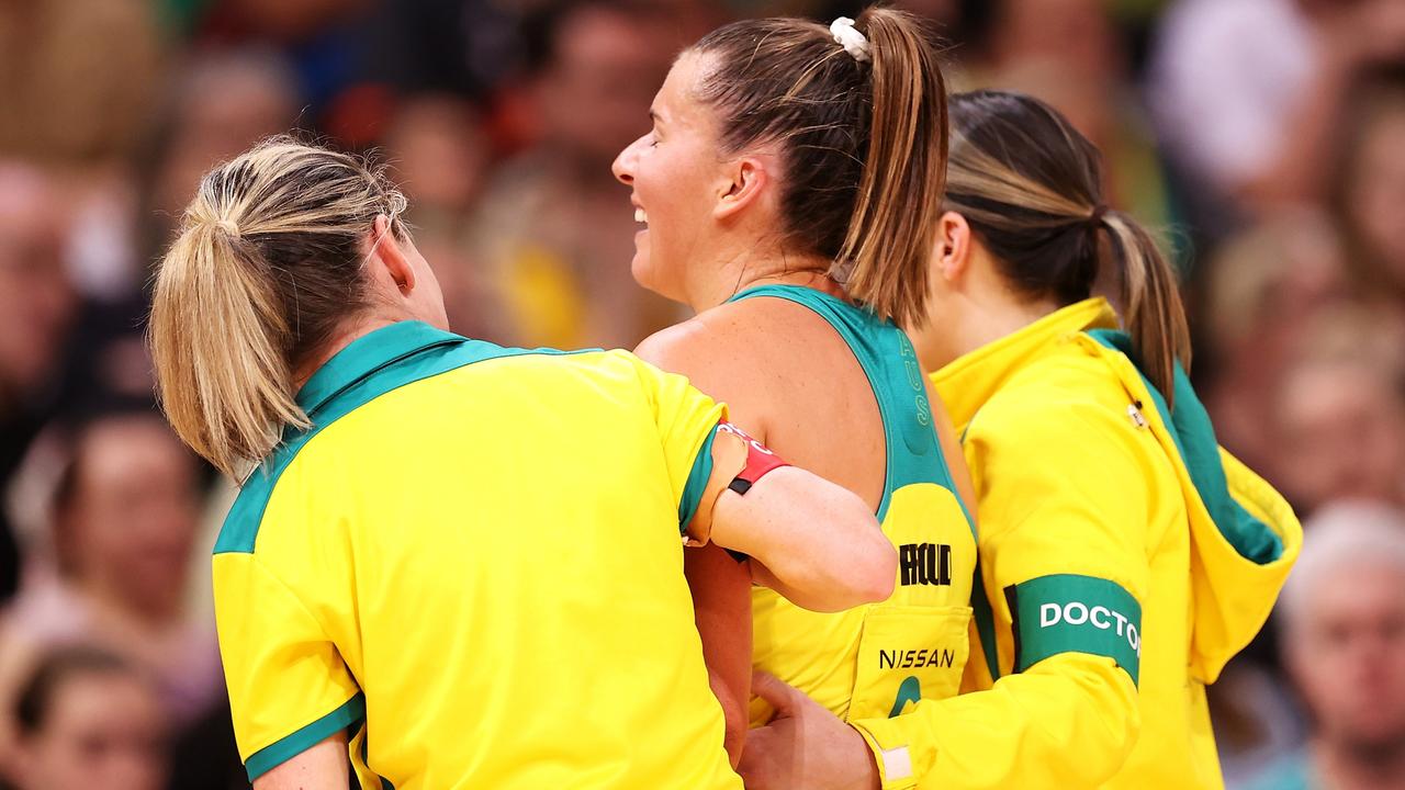 Maddy Proud of Australia is helped from the court during game two of the International Test series between the Australia Diamonds and the England Roses at Qudos Bank Arena. Photo: Getty Images