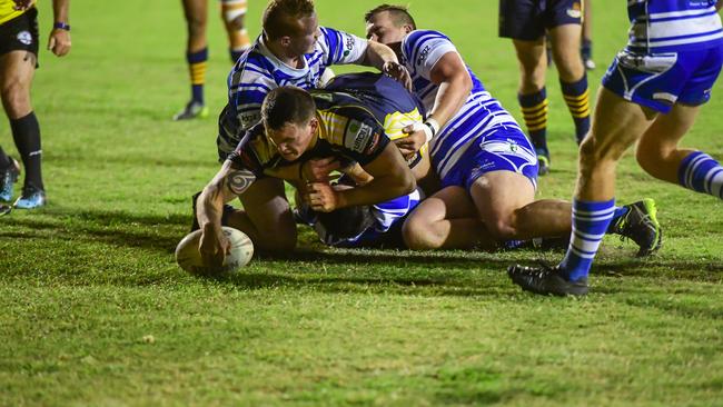 Reece Maughan crashes through the Brothers to score a try for the Waves Tigers.