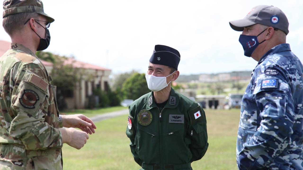 US Air Force Deputy Commander Lieutenant Colonel Adam Shockley, Japanese Air Self Defense Force Colonel Shinobu Yamamoto and RAAF Wing Commander Alan Brown discuss operational matters during Exercise Cope North 21 in Guam tasked with co-ordinated humanitarian assistance and disaster relief missions designed to reinforce trilateral ability to respond to a major natural disaster in the Indo-Pacific region. Picture: Defence