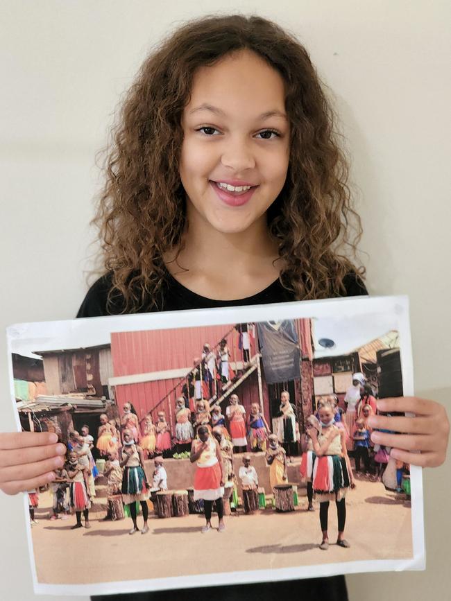 Amalia with a picture of her school in Kenya. Picture: Supplied