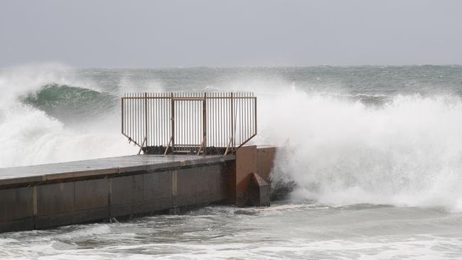 The council once thought about relocating its stormwater pipe that juts into the surf at the centre of Collaroy Beach, but in 2012 the then Warringah Council decided to build a new one in the same spot instead. Picture John Grainger