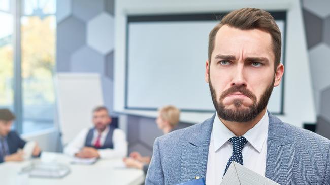 CAREERS: Portrait of sad bearded businessman holding box of personal belongings being fired from work in company, copy space.Unfair dismissal. Fired. iStock.