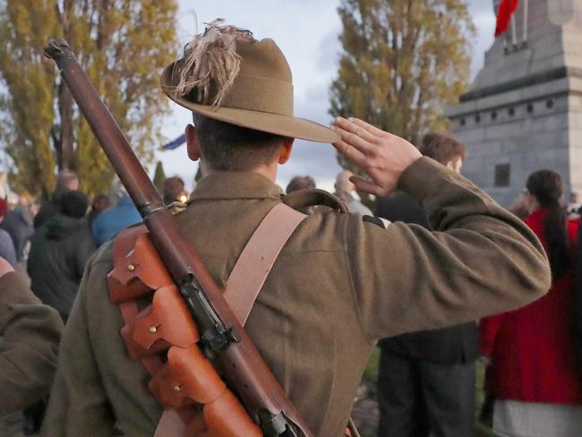 Members of C squadron, 3rd Lighthorse Regiment, Historic Troop salute when The Ode is played at the Anzac day dawn service at the Hobart cenotaph. Picture: PATRICK GEE