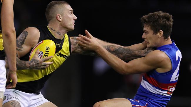 Dustin Martin pushes Bulldog Josh Dunkley out of the way. Picture: Michael Klein