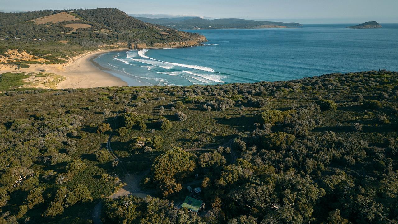 An aerial view of The Headland, showing the cabin (bottom centre) and the 8ha property, surrounded on three sides by conservation area and towering sea cliffs.