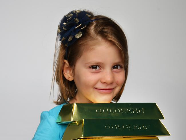Iris aged 5yrs old with chocolate gold, pictured in NewsCorp studio, Surry Hills.