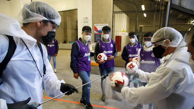 Soccer balls are disinfected before a game in Guadalajara, Mexico. Picture: AFP