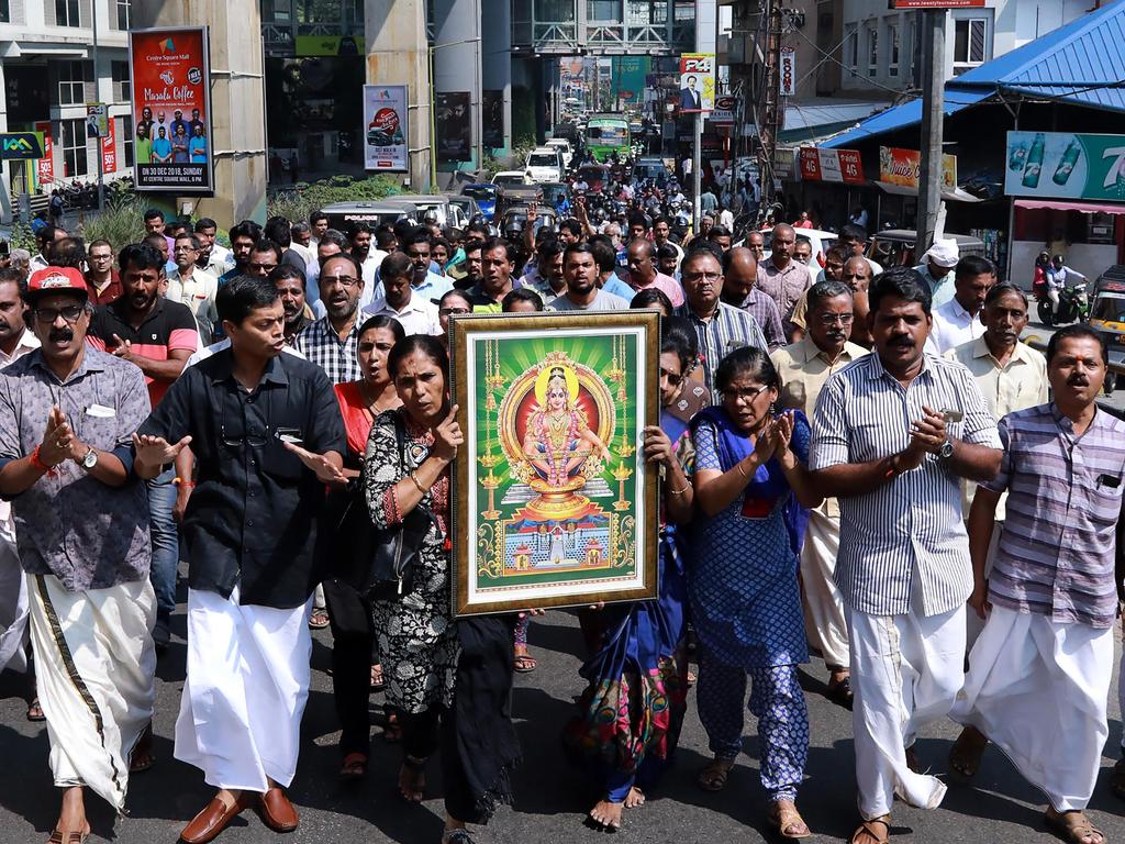 Protesters carry a picture of the Hindu deity Ayyappa at a demonstration. Picture: AFP