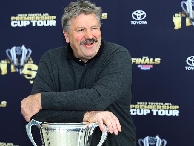 Broadcaster Brian Taylor with the  2022 Premiership Cup during a visit to Blood Toyota. Picture: Alison Wynd