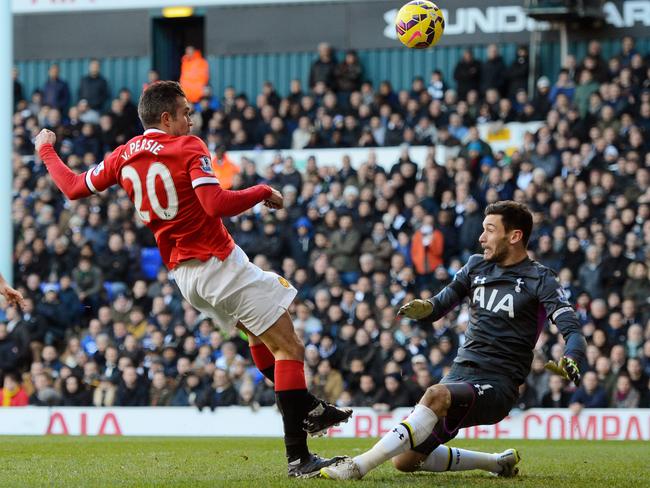 Robin van Persie of Manchester United has his attempt on goal saved by goalkeeper Hugo Lloris of Spurs.