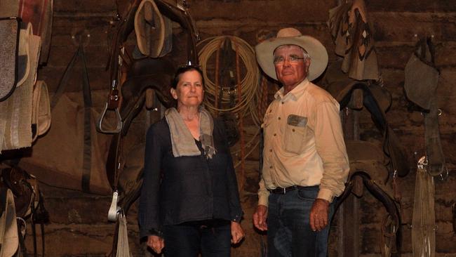 Peter and Jane Hughes on the horse gear shed on Tierawoomba Station.