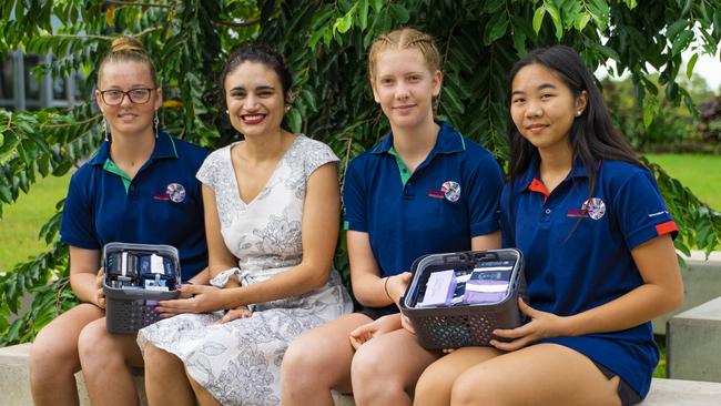 Darwin Middle School student Caitlin Fitzgerald, 14, Education Minister Lauren Moss, Cassia Latz, 14, and Sophie Lei, 14, are excited for the new initiative. Picture: SUPPLIED