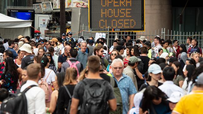 Police helping direct the crowd at Circular Quay. Picture: Monique Harmer