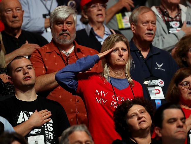 Attendees sing the National Anthem at the NRA convention. Picture: AFP