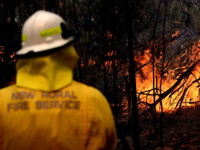 NSW Rural Fire fighters establish a backburn  in Mangrove Mountain, New South Wales, Sunday, December 8, 2019. (AAP Image/Jeremy Piper) NO ARCHIVING