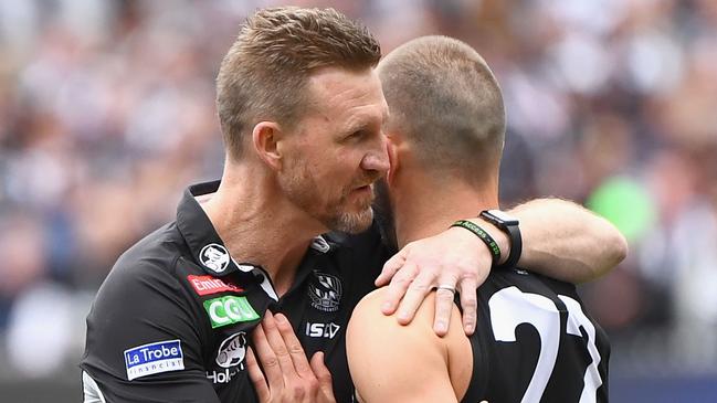 Buckley hugs Steele Sidebottom after the 2018 grand final defeat.