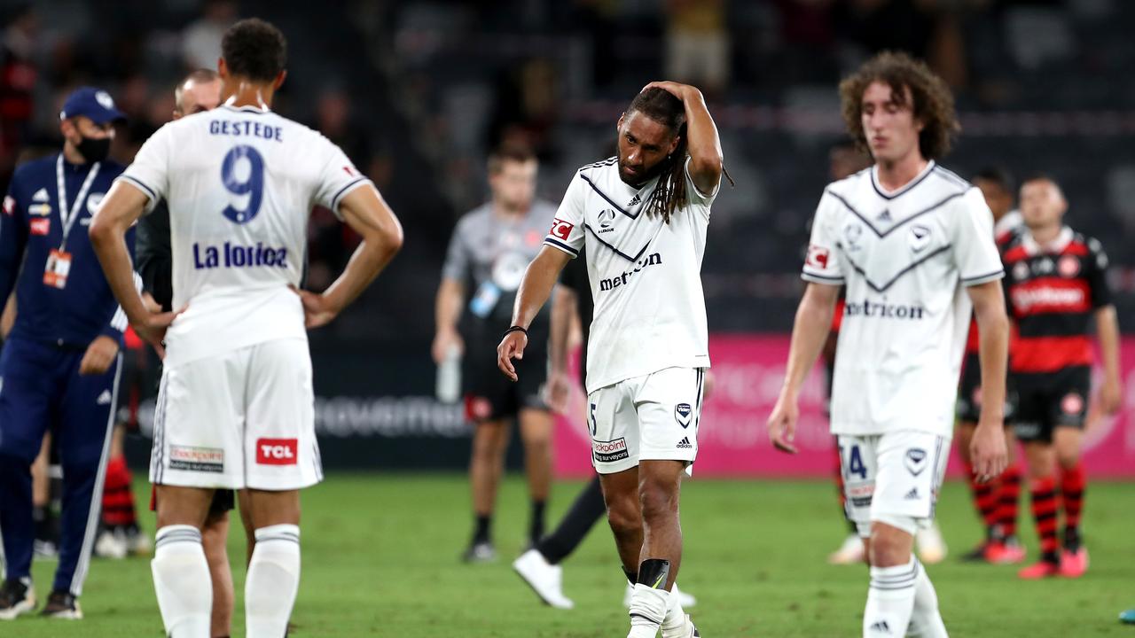 Melbourne Victory players reflect on yet another loss. Picture: Brendon Thorne/Getty Images