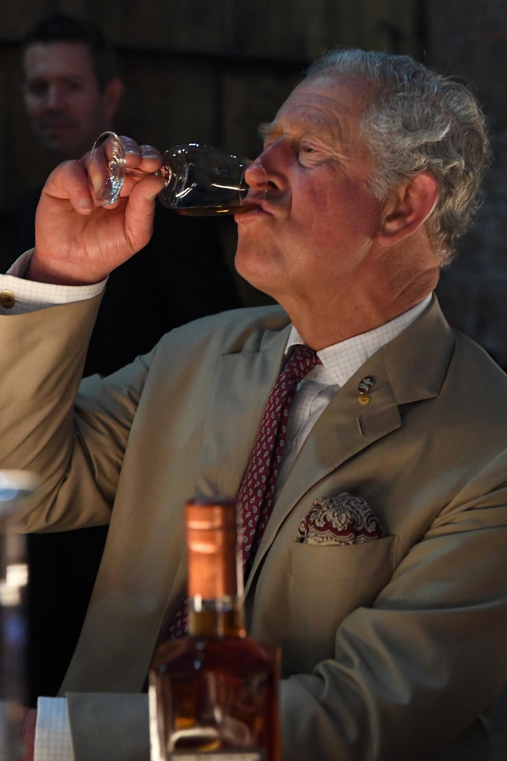 Prince Charles samples rums at the Bundaberg distillery.