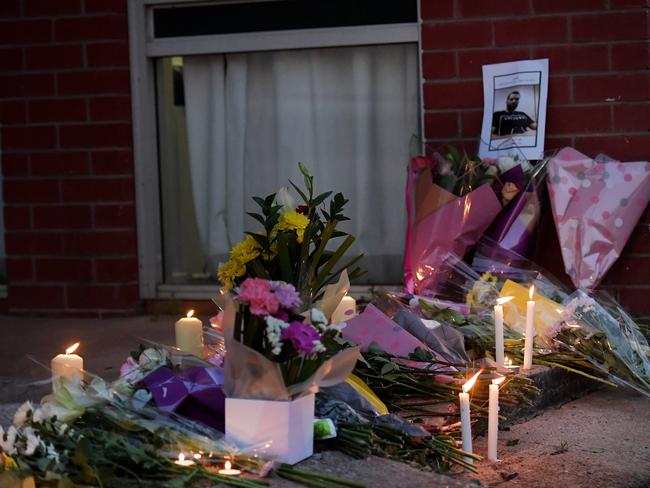 Flowers and candles at the Palms Motel where taxi driver Hassan Baydoun was killed. Picture: Keri Megelus