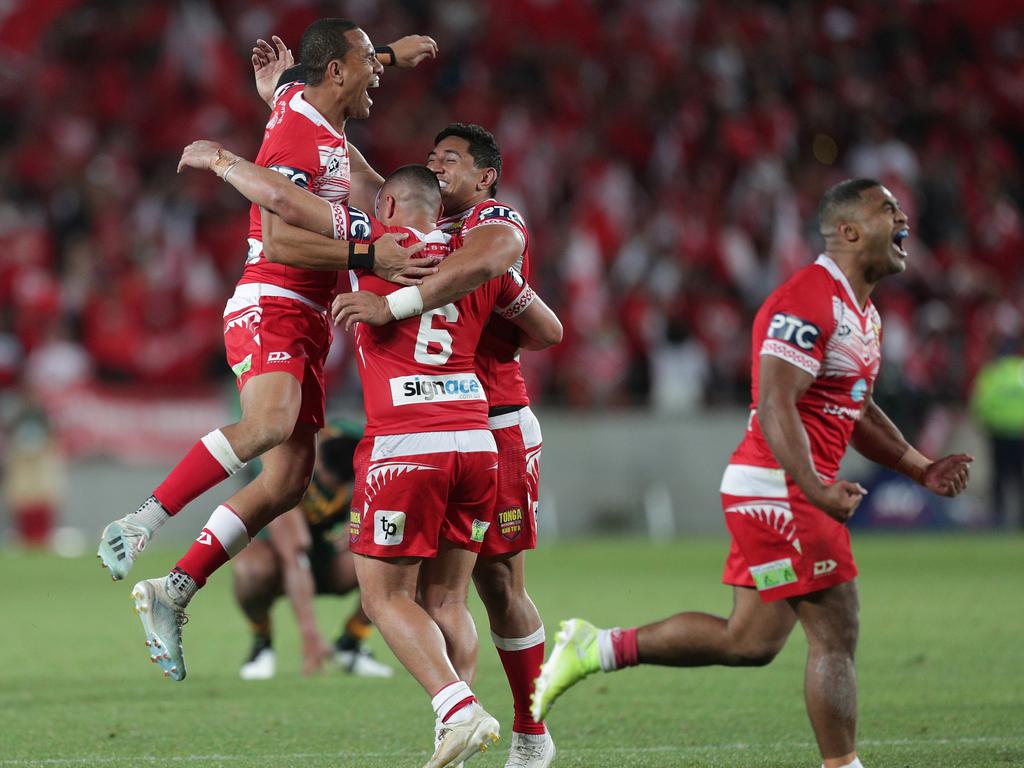 Tonga celebrate their historic victory over Australia (AAP Image/David Rowland)