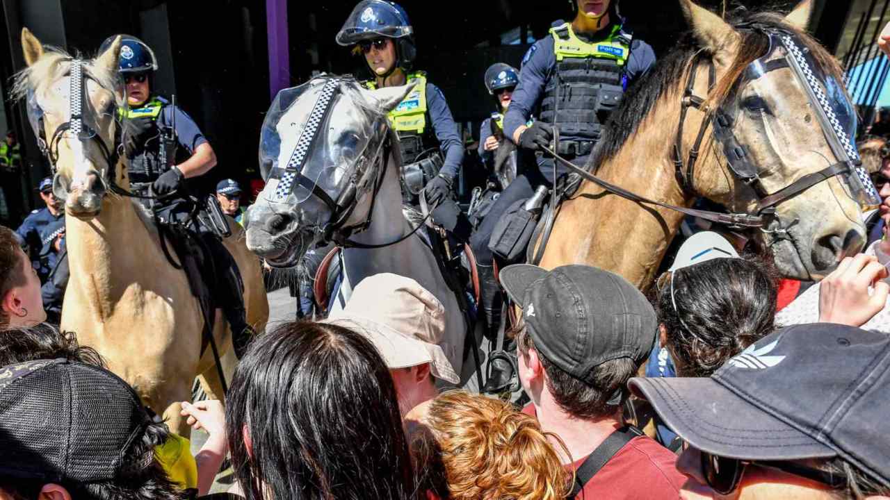 Activists glue themselves to car park ramp amid Melbourne climate protests