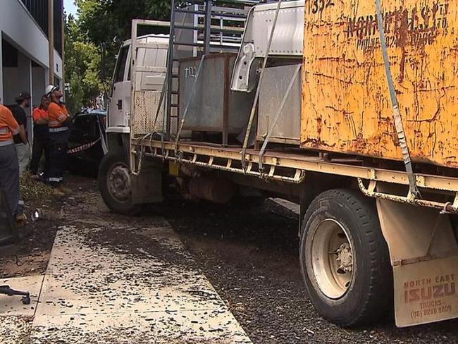 An out-of-control truck has left a trail of destruction outside a popular gym at Alberton. The vehicle ploughed into parked cars when the driver suffered a medical episode. Picture: 7NEWS