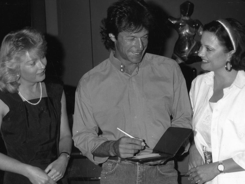 Imran Khan signs autographs for Adelaide Casino PR chief Roslyn Kitt (left) and Mystics nightclub manager Sharon Betty at The Adelaide Hotel in 1990. Picture: News Limited 