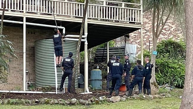 Police divers look at a water tank at the house where William Tyrrell was last seen. Picture: NCA NewsWire / Peter Lorimer.