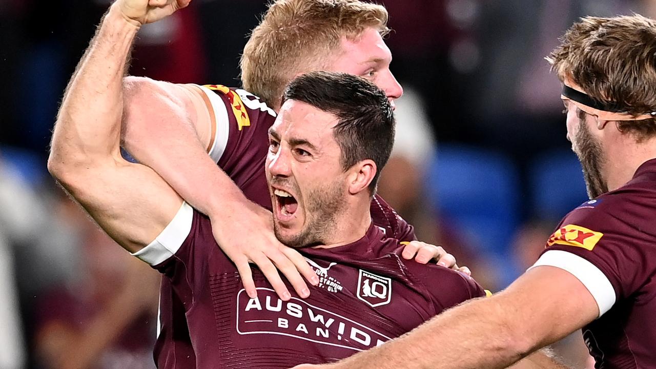 GOLD COAST, AUSTRALIA - JULY 14: Ben Hunt of the Maroons celebrates with teammates after scoring a try during game three of the 2021 State of Origin Series between the New South Wales Blues and the Queensland Maroons at Cbus Super Stadium on July 14, 2021 in Gold Coast, Australia. (Photo by Bradley Kanaris/Getty Images)