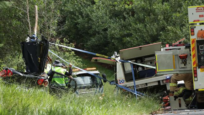 The scene on Old Gympie Road at Glasshouse Mountains where two people were killed after a tree fell on their car. Picture Lachie Millard